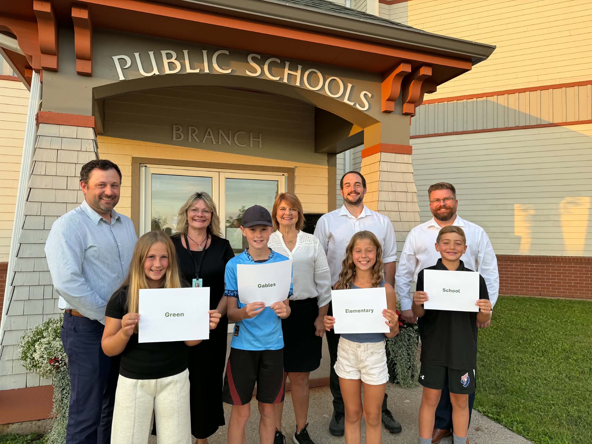 Students join Public Schools Branch Staff and Trustees to announce the name of 'Green Gables Elementary"